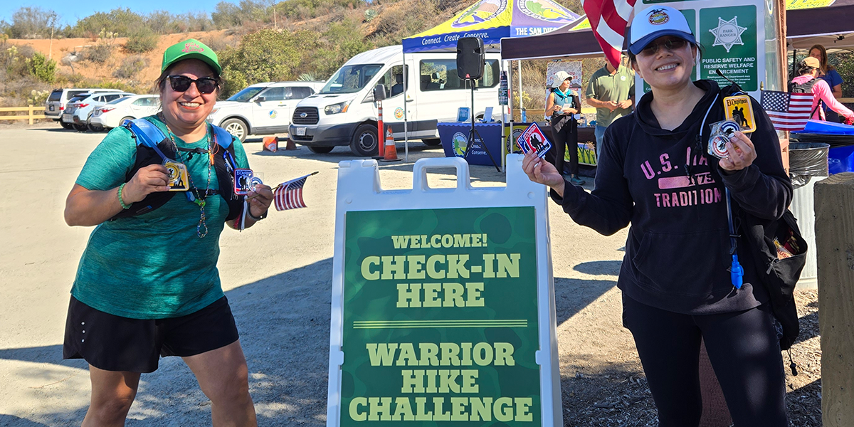 Hikers show off their Memorial Day, Veterans Day and Champion Challenge coins